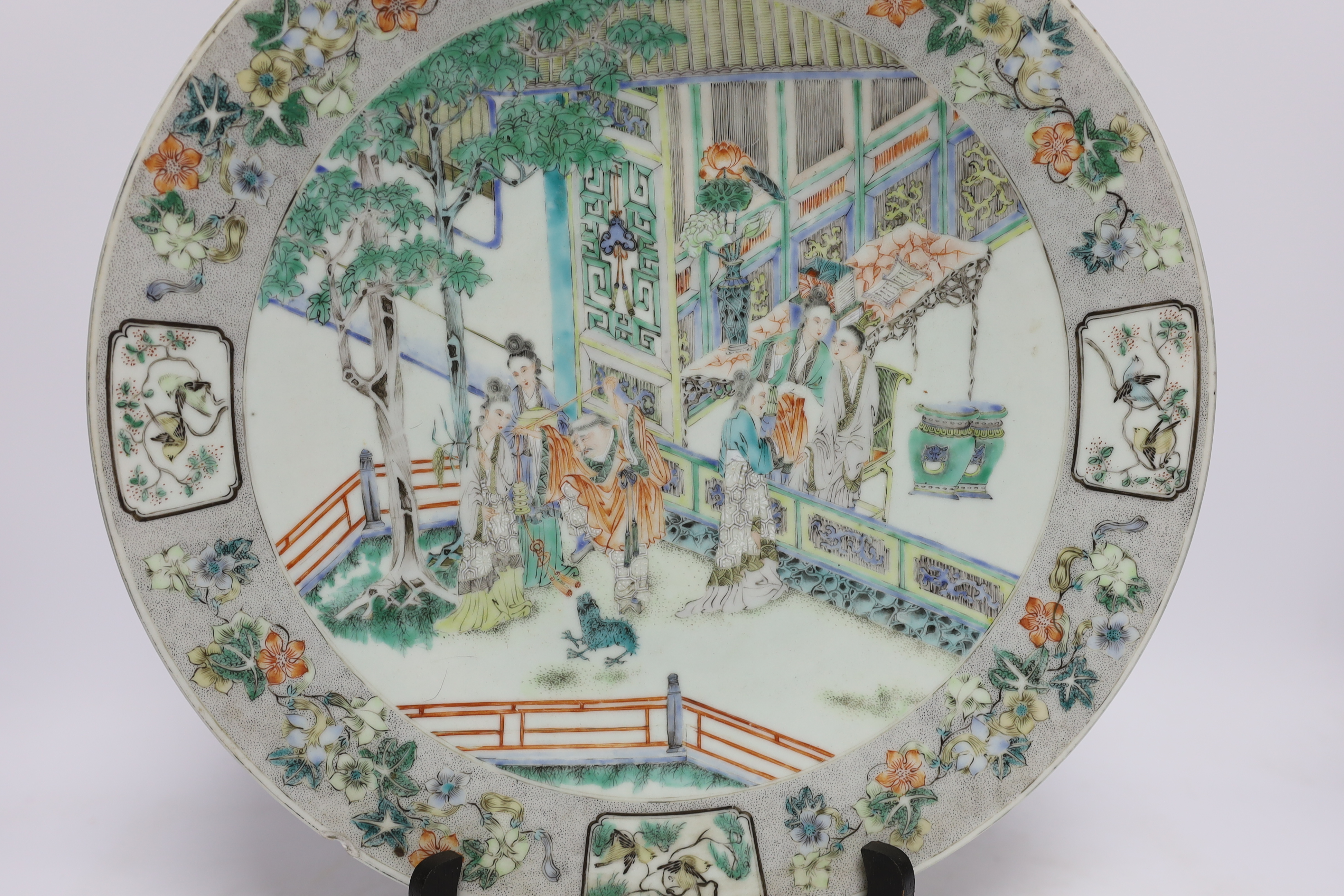 A Chinese famille verte ‘ladies’ dish, 19th century, chipped, 34cm diameter